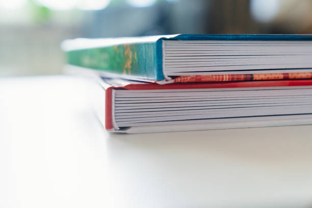 istock the binding of photobooks with plastic pages on a white table. 1458681960