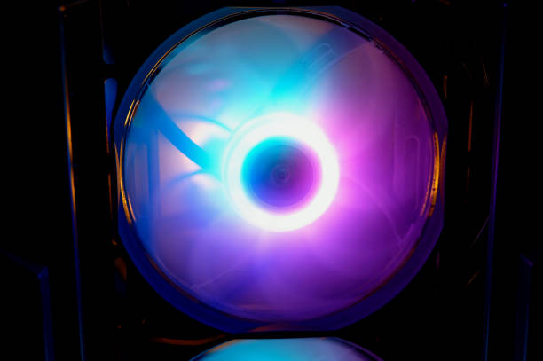 istock Computer cooler with RGB LED light. Computer circuit board and CPU cooling fans illuminated 1458682490