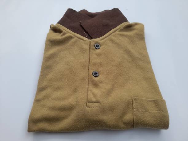 istock brown cotton polo shirt top view on white background. 1458682717