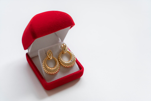 Glamorous antique Golden pair of earrings on white background. Luxury female jewelry, Indian traditional jewellery, kundan earring,Bridal Gold earrings wedding jewellery,Vintage earrings