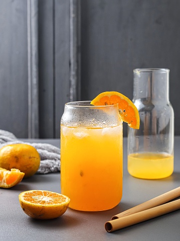 glass of fresh orange juice with fresh fruits. Isolated