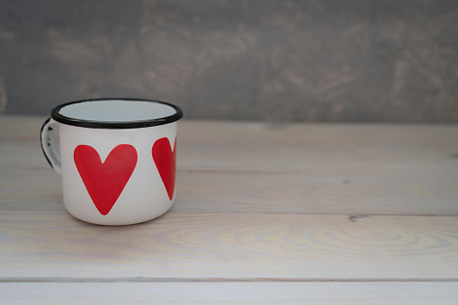 Porcelain white cup on a saucer with gilding. Isolated on a white background