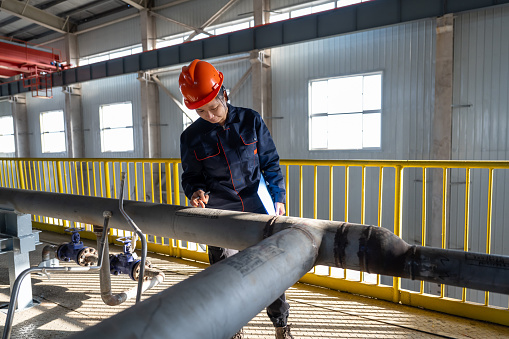 A Chinese female engineer works in a chemical plant