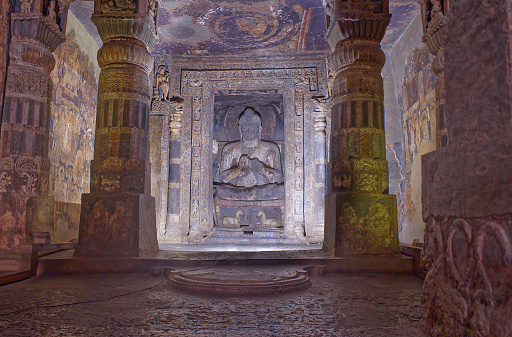 There are massive rock cut sculptures of deities and of the Buddha inside each cave, many are flanked with ornate columns and paintings