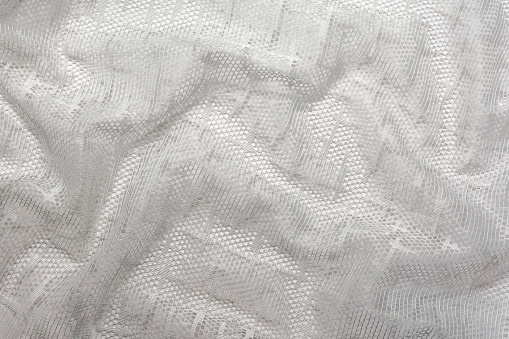 A pattern of crumpled white tulle