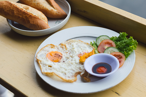 fried egg food eaten with bread