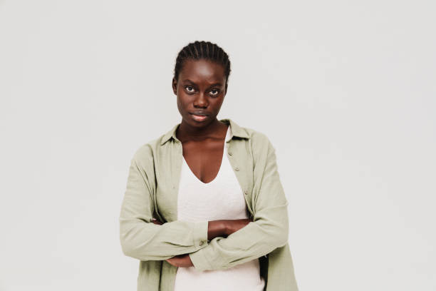 istock Young black woman with afro braids posing at camera 1458692515