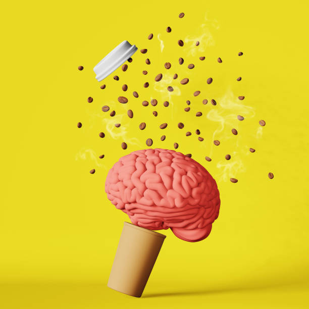 istock Floating human brain steaming coffee beans explosion cup 3D rendering yellow. Energy charge Caffeine hot drinks benefits 1458695843