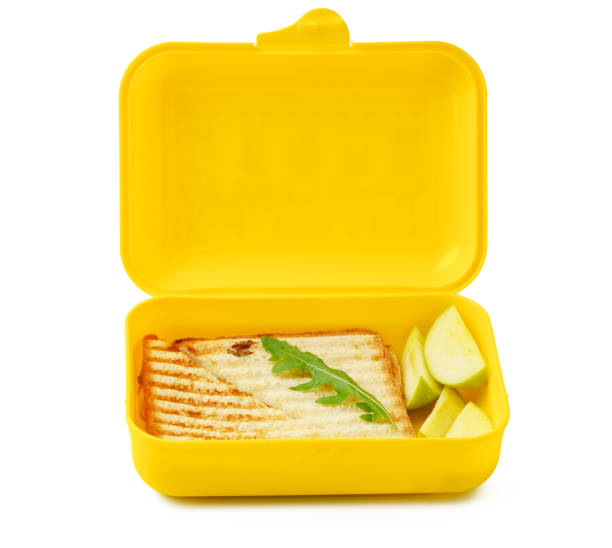istock Grilled sandwich in yellow plastic lunchbox isolated on white 1458696924