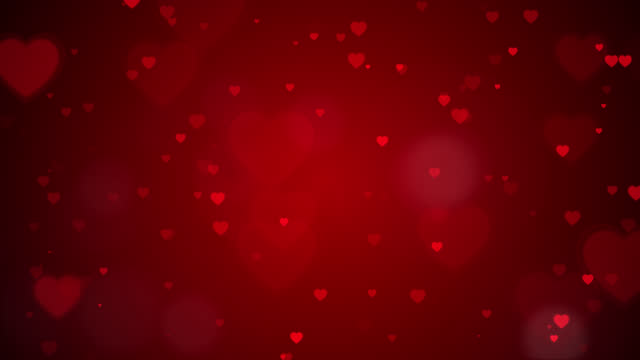 Loop video, Red Hearts motion and bokeh for Valentine's day Greeting love video. 4K Romantic looped animation on dark red background for Valentine's day.