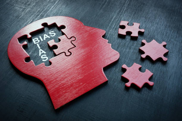 A Head with puzzle pieces and word bias. stock photo