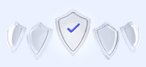 istock Glass transparent shield icon set 3d render. Protect and safety symbol with blue check mark, antivirus badge, computer or mobile access security isolated on background front side view 1458700525