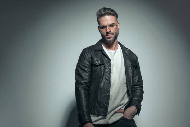 istock fashion guy posing with attiude, putting a hand in pocket 1458700940