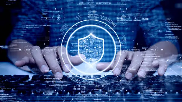 Photo of digital technology concept cyber security data protection internet network connection. Man accessing a computer device with a protective shield against cyber threats. polygon on dark blue background.