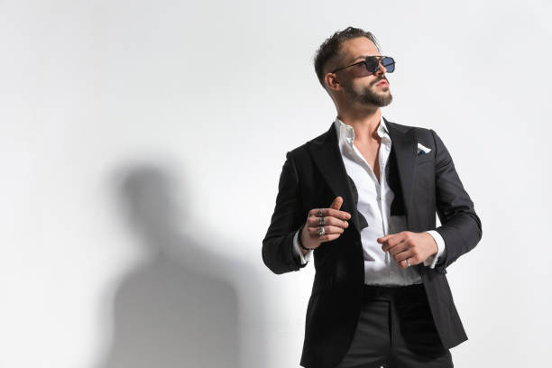 istock businessman being dramatic and wearing a black tuxedo 1458701879