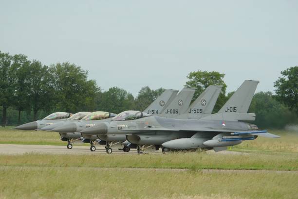 F-16 Fighting falcon from Netherlands air force, at Volkel airbase lockheed martin F-16 Fighting falcon from Netherlands air force, at Volkel airbase ready for take off, the netherlands military building photos stock pictures, royalty-free photos & images