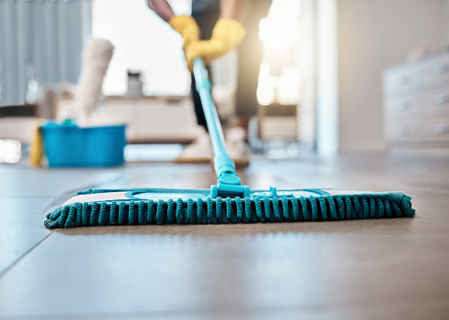 Man, mopping or cleaning floor in house, home or hospitality hotel for housekeeping product service, maid or worker. Zoom, cleaner or bacteria spring clean, hygiene health or living room maintenance