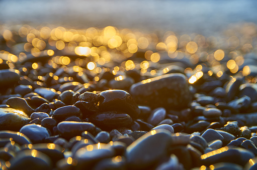 Pebble stones lay in the sunlight