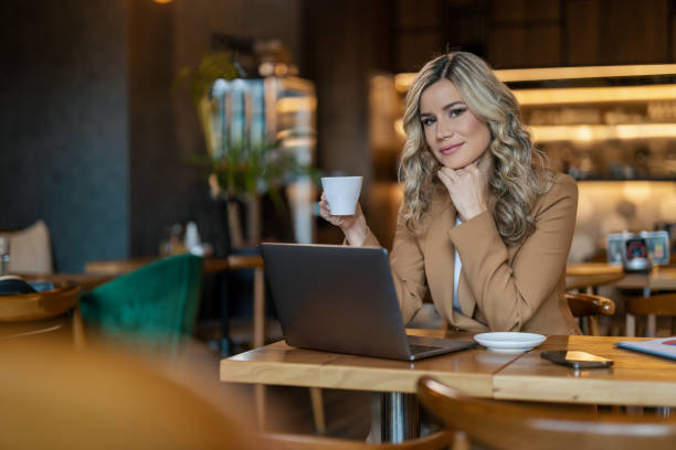 istock Businesswoman working online from cafe 1458704721