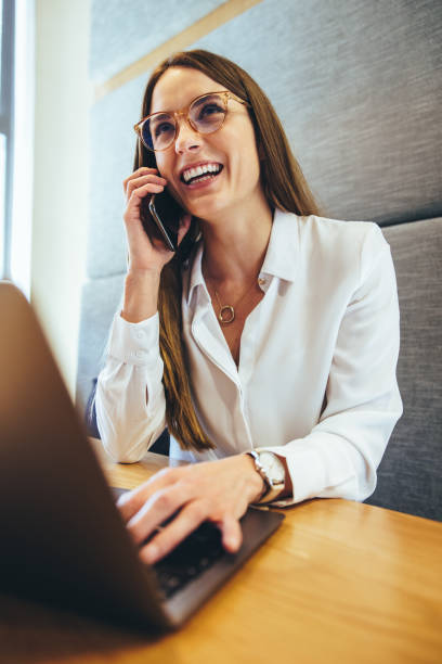 istock Smiling businesswoman taking a phone call 1458706131
