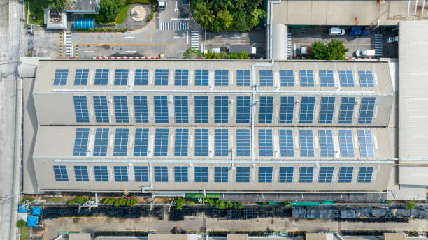 istock Top view Solar Cell on Warehouse Factory. Solar photo voltaic panels system power or Solar Cell on industrial building roof for producing green ecological electricity. Production of renewable energy. 1458706630