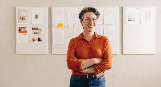 istock Cheerful female designer smiling at the camera 1458706687