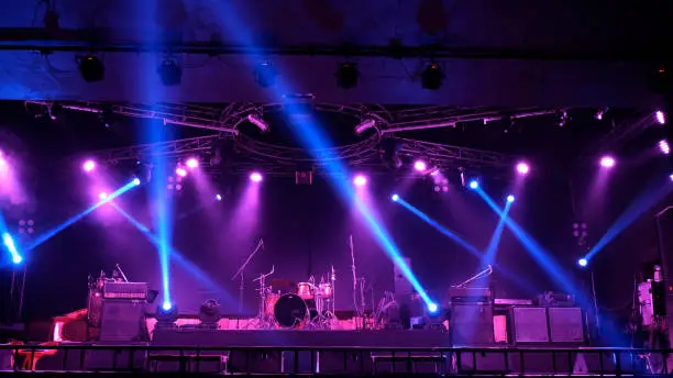 Photo of Stage lighting beams spotlight and smoke of events show or concerts