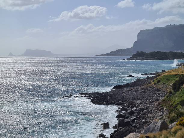 istock maritime coast with promontory on the background in Sicily, Italy 1458707689