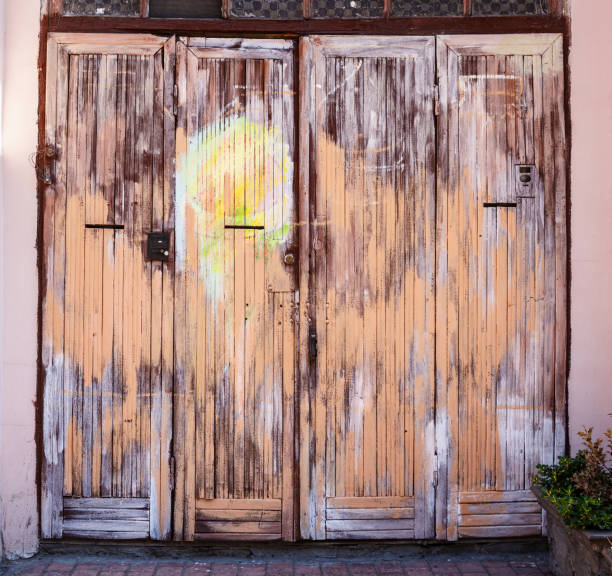 istock Weathered wooden painted door. 1458709439