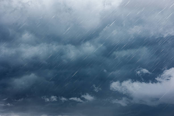 istock raining dark cloudy storm cloud nature in rainy season 1458711139