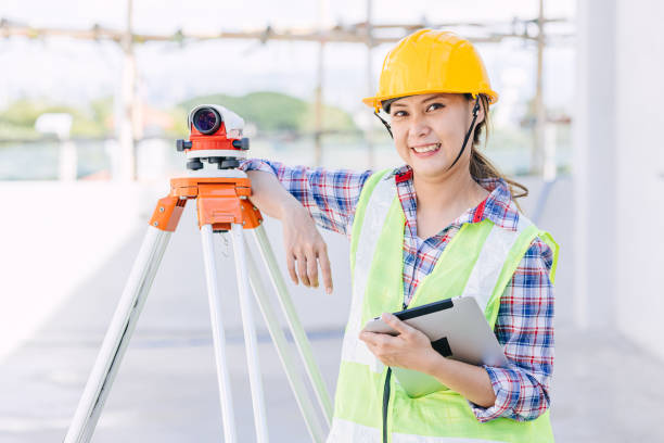 istock woman worker engineer with digital tablet survey equipment auto levelling camera happy smile 1458711245