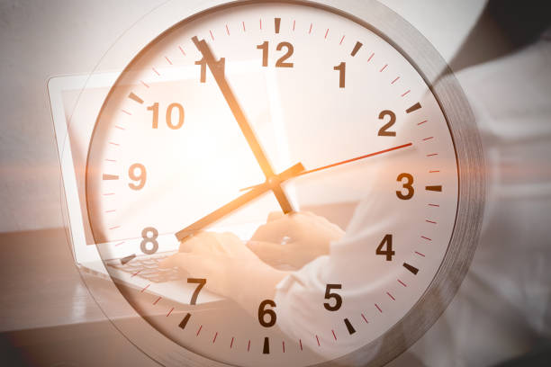 istock Business working time, office hours concept. businesspeople using laptop computer overlay clock face 1458711291
