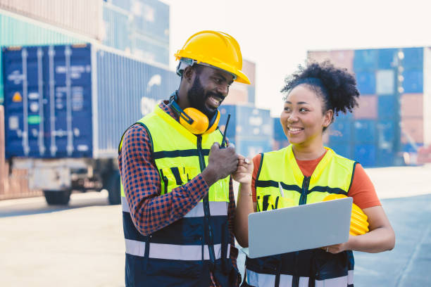 istock African worker people teamwork happy working together in port cargo shipping industry loading container yard 1458711336