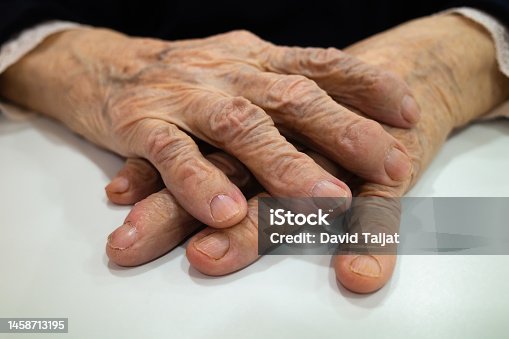 istock Hands of an old wife 1458713195