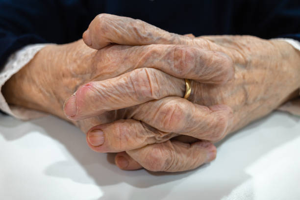 istock Hands of an old wife 1458713204