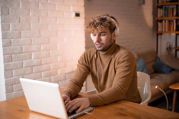 istock Young fashionable man working at home 1458717499