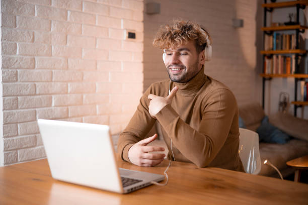istock Young fashionable man working at home 1458717507