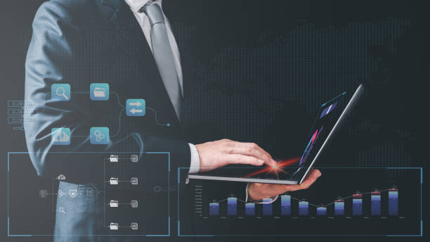 istock finance and investment Analyst working with Business Analytics and Data Management System on computer, make a report with KPI and metrics connected to database. Corporate strategy for finance, operations, sales, marketing 1458720182