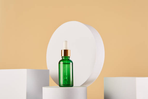 istock Aroma oil, serum bottle mock up on yellow background. 1458722736