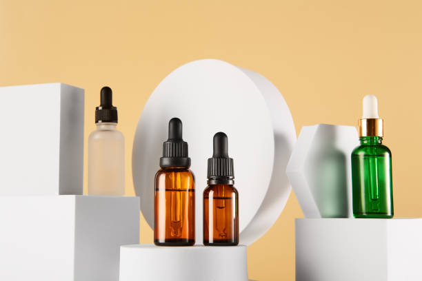 istock Dropper vials with serum are on white geometric shapes. 1458722766