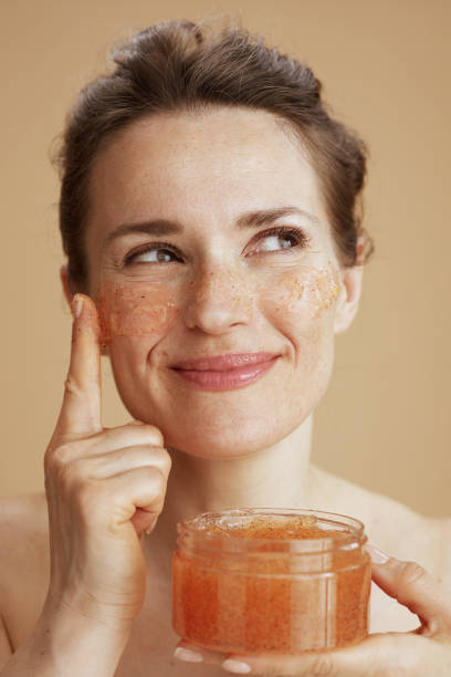 istock happy woman with face scrub 1458722831