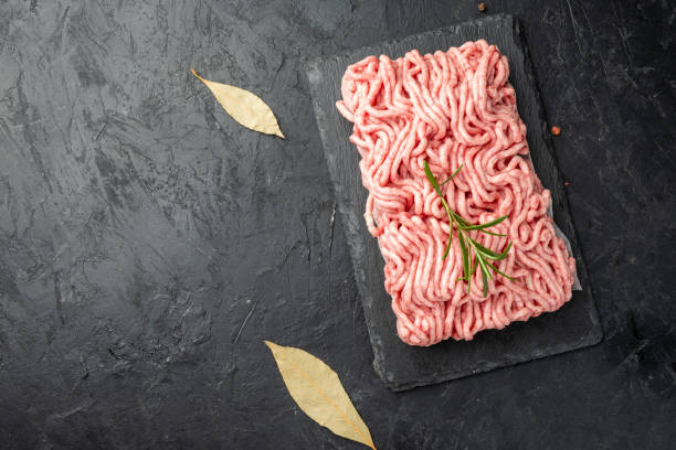 istock Raw minced beef and pork, top view, free space on the left. dark background. 1458723608