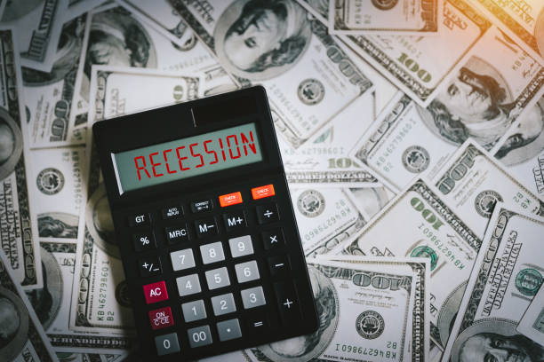 istock Recession text in calculator with Glowing red arrow going downwards the Inflation and recession of the economy and dollar The concept of economic collapse and the collapse of the stock exchange. 1458723733