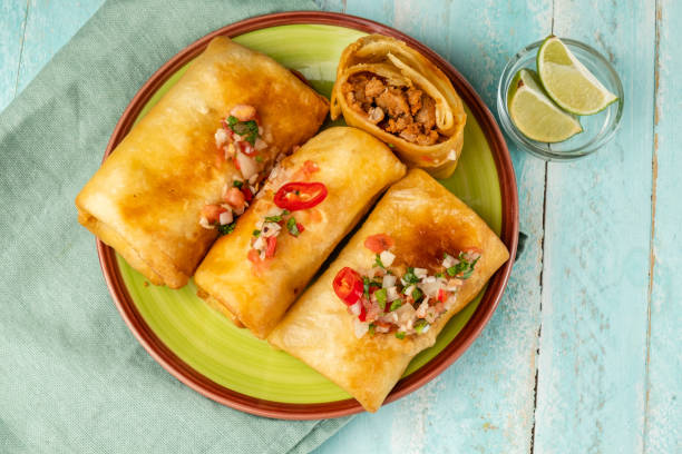 istock Chimichanga three pieces in a green plate 1458724125