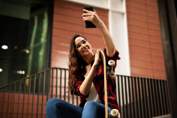 istock Happy smiling woman using the phone. 1458726042