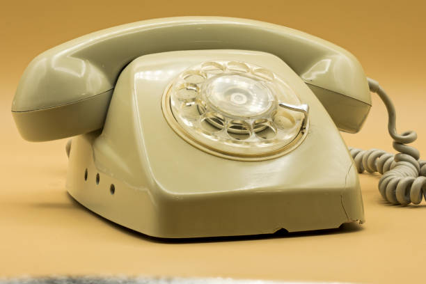 istock beautiful old wheel phone on orange background 1458727320