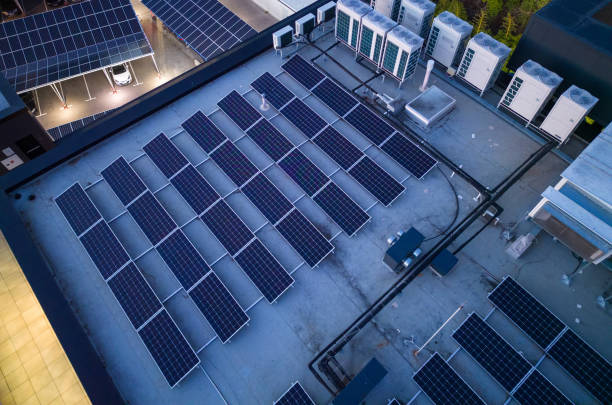 solar panels on the roof of a office building stock photo