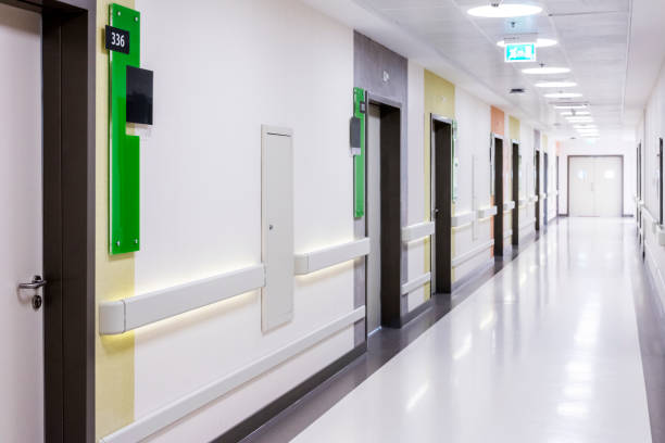 Hospital corridor with rooms stock photo