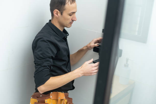 istock Plumber installing a shower cabin in bathroom 1458732072