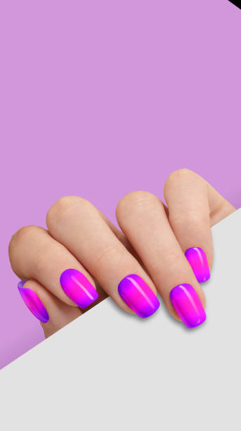 istock Manicured woman's hand holding white paper 1458734055